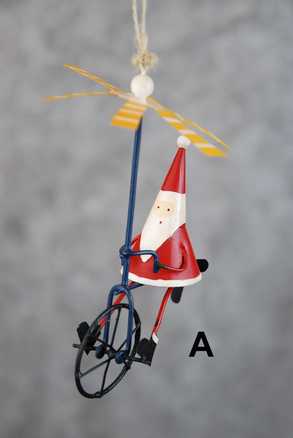 Weihnachtsmann / Schneemann auf dem Einrad